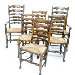 A set of six ash ladder back armchairs, in 19thC style, each with a rush seat on turned legs with st