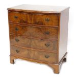 A walnut and figured walnut bow fronted chest, the top with a moulded edge above four drawers with d