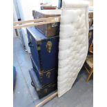 A cream floral headboard, and various cabin trunks. (5)
