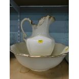 A white and gilt finish wash jug and bowl set.