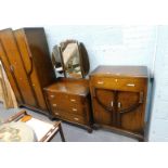 An oak three piece bedroom suite, comprising wardrobe, dressing table and tallboy, in the Art Deco s