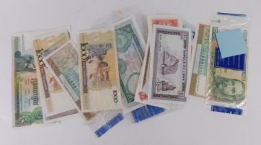 A group of banknotes, comprising Middle Eastern five hundred rupees, Bank of Central Peru one thousa