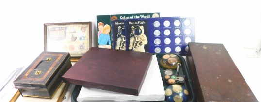 A group of collectors coin packs, framed space collectors coins, coin paperweights, collectors crown