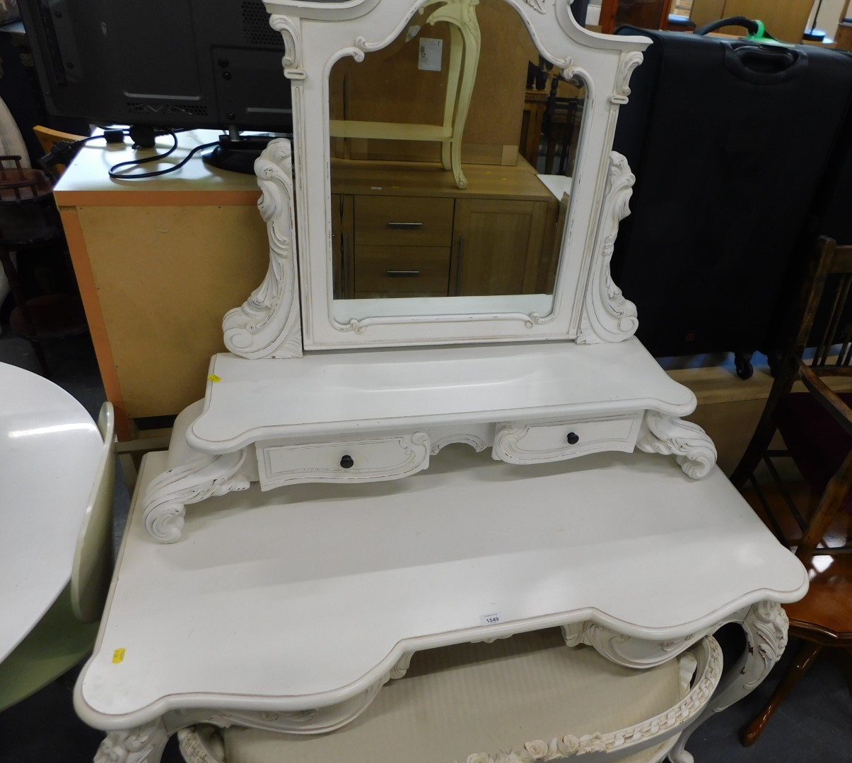 A white dressing table, cabriole scroll design in the French style, with mirror back, and two seat s