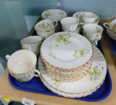 A Bean Co part tea service, on a white ground decorated with flowers.