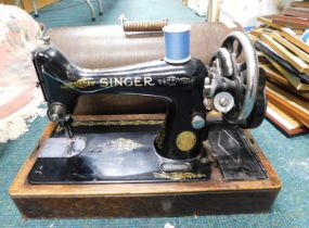 A cased Singer sewing machine.