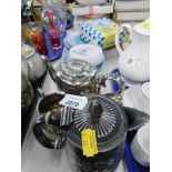 A silver plated four piece part tea and coffee service, a Carello light, pottery server and three si