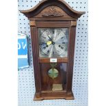 A Lincoln oak cased 31 day movement wall clock.