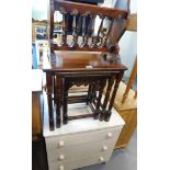 A nest of three mahogany tables, Indonesian magazine rack, a three drawer chest, pine console table,