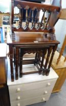A nest of three mahogany tables, Indonesian magazine rack, a three drawer chest, pine console table,