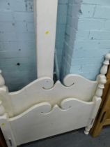 A cream painted pine single bed frame.