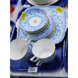 A Royal Crown Derby blue and white butterfly pattern part service, comprising cake plate, four cups