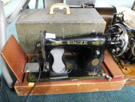 A cased Singer sewing machine, serial number Y941904. WARNING! This lot contains untested or