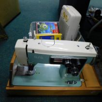 A cased Alfa sewing machine, Consort Fantom heater, Disney Pixar Scream Alley mini game, etc.