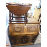 A walnut bureau, with carved friezes, fall flap and two cupboard door, with small drop leaf side tab