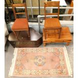 Two dining chairs, a hardwood coffee table, a mahogany corner TV stand, and a pink wool cut rug. (5)