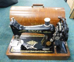 A cased Singer sewing machine.