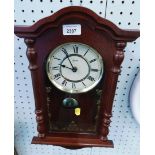A Hermle mahogany cased wall clock.