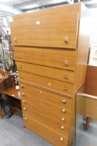A teak bedroom suite, comprising two chest of drawers, and a dressing table.