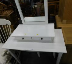 A white dressing table and stool.