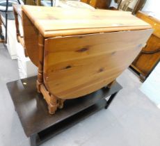 A mahogany low coffee table and a pine drop leaf table. (2)