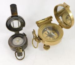 Two reproduction brass compasses, comprising a Natural Sign, and a TG Co Limited of London mark 3 co