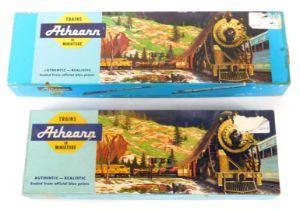 Two Atheann train sets, comprising The Authentic Miniature Milwaukee Road tender, in yellow, boxed,
