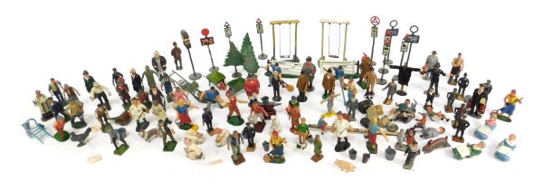 A group of Britain's and other lead figures, to include people and fences, street signs, wheelbarrow