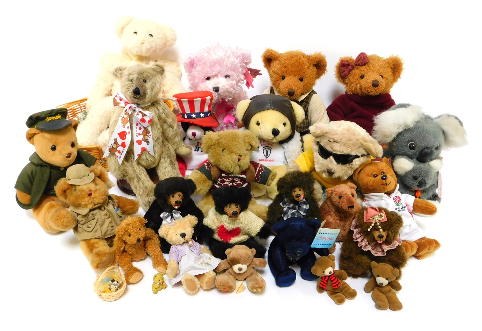 A group of soft toy bears, to include a Harrods plush doorman or chauffeur bear, a commemorative Eng