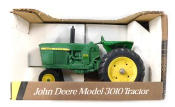 An Ertl John Deere 1960 model 3010 tractor, boxed.