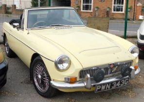 A 1968 MGC Roadster convertible, registration PWN 343G, in pale primrose yellow, with rare Lenham dr