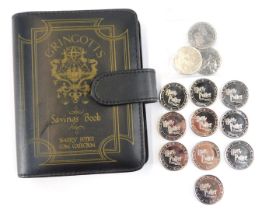 A Gringots Saving Book, with a collection of Harry Potter coins.