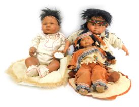 An ADG Little Wolf collectors doll stamped S.B.04, in Indian chief type dress, 42cm long and two oth