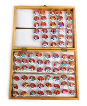 A group of Pokemon 2000 collectors pin badges, each depicting a different character, contained in an