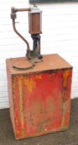 A vintage oil pump dispenser, with hand crank.
