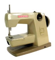 A Vulcan miniature sewing machine.