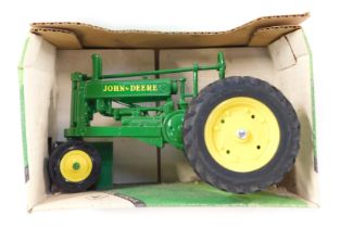 An Ertl John Deere 1934 model A tractor, boxed.