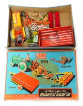 A Mettoy Playthings Modern Farming Mechanical Tractor set, comprising tinplate tractor and plough (A