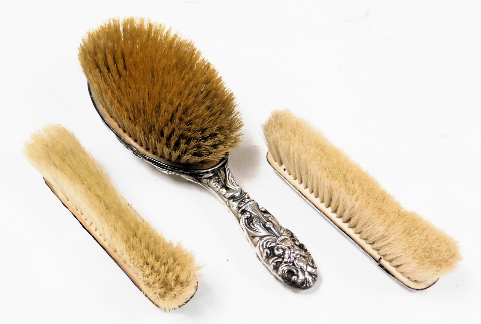 An Edward VII silver back hair brush, embossed with masks, birds, drapes and foliate scrolls, London - Image 2 of 3