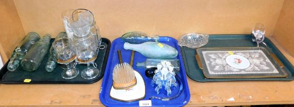 Glassware, to include vintage bottles, drinking glasses, decanters, and a tray with embroidery base.
