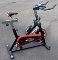 A WER Sports exercise bike, on stand.