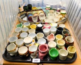 Various egg cups, to include glass and ceramic. (2 trays)
