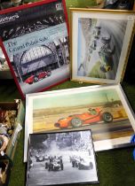 Four framed and glazed pictures of racing cars.