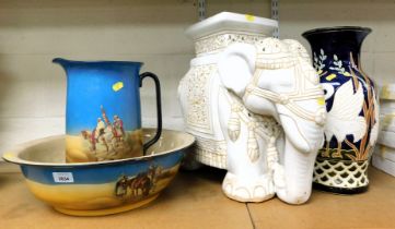 A jug and basin wash set, a large white glazed garden elephant seat and a vase with stalks.