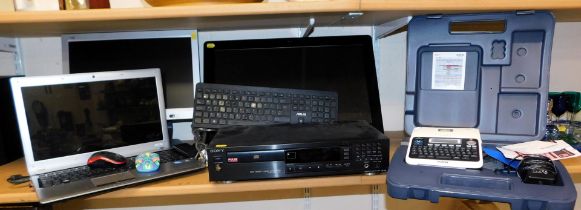 A Sony Hi Density Linear converter, Brother word processor, two televisions and a Samsung laptop.