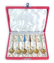 A cased set of six Naemi Henningsen enamelled gilt spoons, each stamped ELA Denmark Sterling 925S, 1