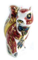 A Royal Crown Derby porcelain paperweight modelled as Woodland Squirrel, gold stopper and red printe