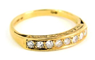 An 18ct gold half hoop diamond dress ring, set with eight round brilliant cut diamonds, each approx