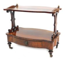 A Victorian rosewood low two tier stand, with a drawer to the lower tier, on turned and tapered legs