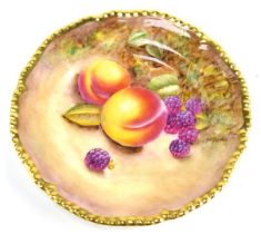 A Royal Worcester porcelain plate, hand decorated decoration depicting peaches and blackberries, wit